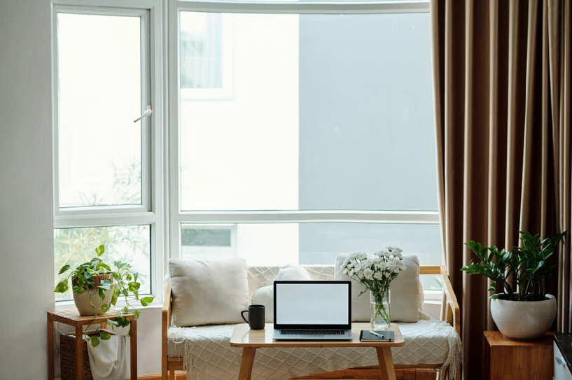 Comfortable room with a sofa and large windows, installed by an expert team.