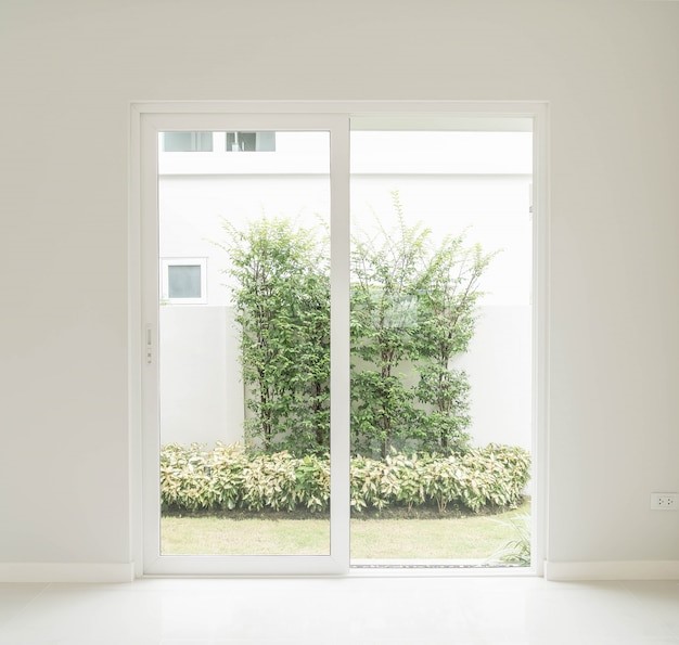 Door with a view of the house's garden, showcasing the completed renovation after the owner obtained permission to change window to door.