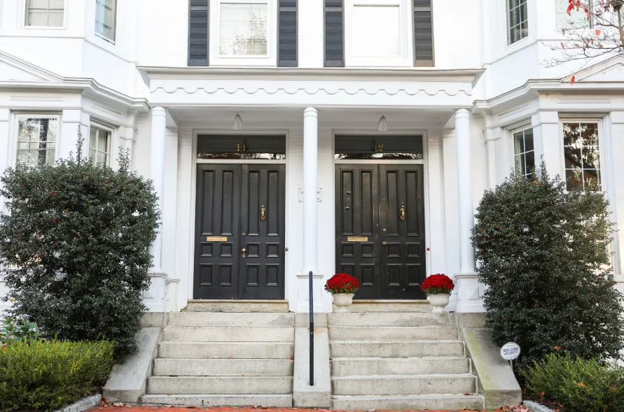 Huge American house with two entrance doors, representing the front door color trends.
