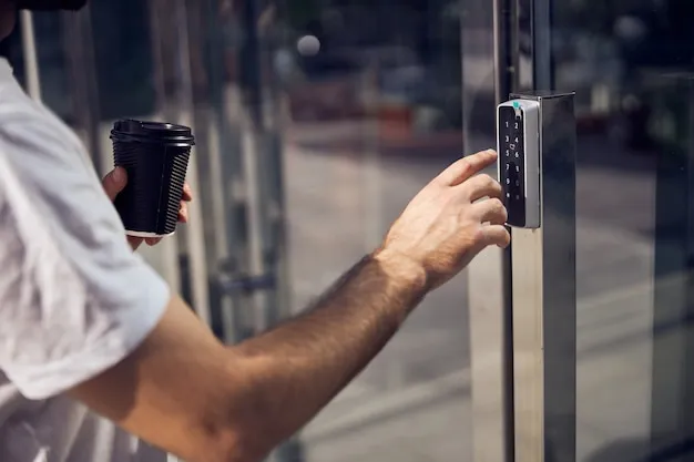 A man typing the code in an electronic lock to enter a building, representing the security of high-quality commercial windows and doors.