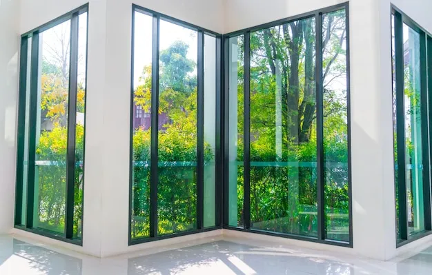 Glass windows with a view of a green garden, representing eco-friendly windows and doors.