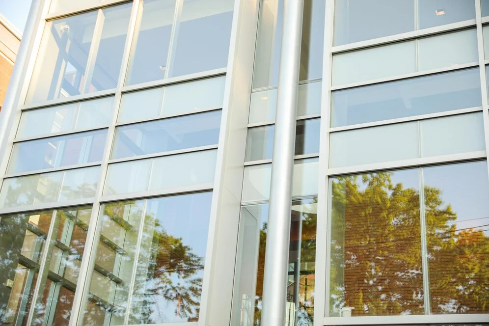 Building with a large window, representing the importance of investing in energy-efficient commercial windows.